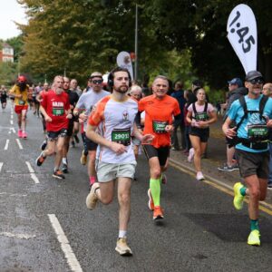 A man running a race wearing a Ronald McDonald House Charities UK tshirt